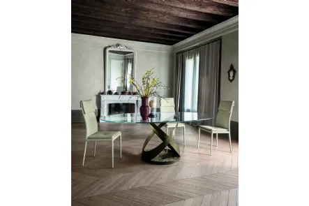 Tavolo rotondo con struttura in metallo e base in marmo con top in vetro di Tonin Casa